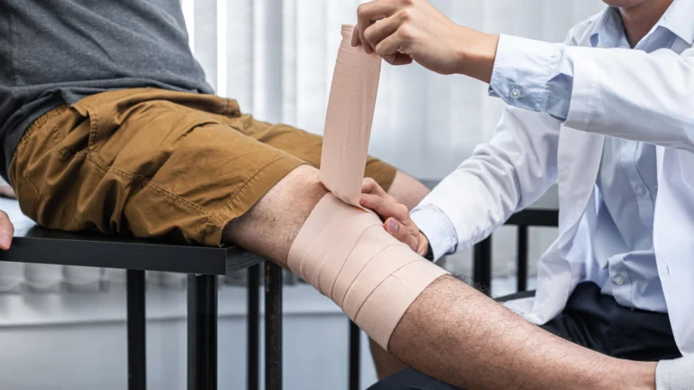 injured leg being wrapped with bandages
